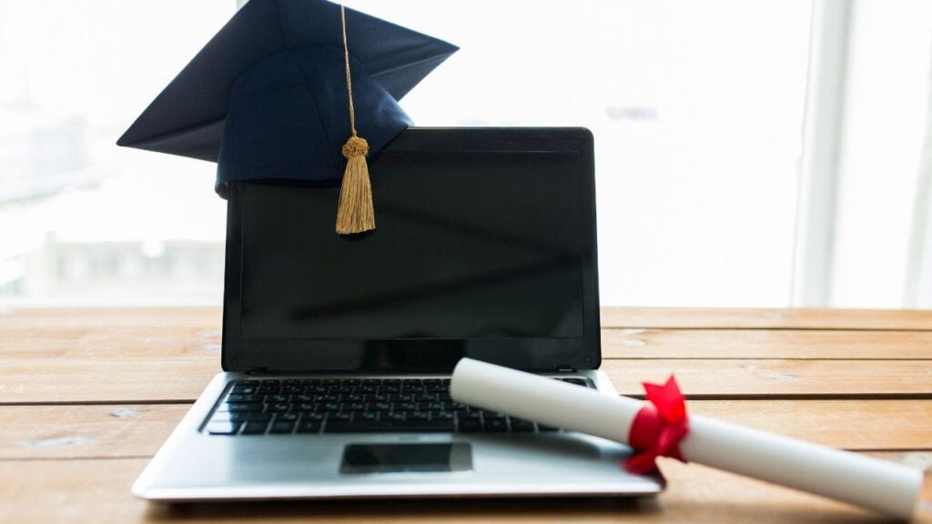 The Big Question: “How Do I Get My Original Certificate If I Lost It’? 2 blank screen laptop with graduate cap and graduate diploma next to it