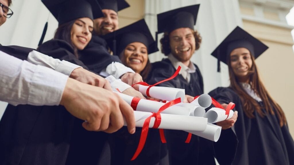 Looking for Same Day Diploma Download? Here are the Best Options and Alternatives! 2 graduating high school students holding diplomas